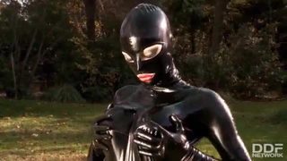 Fetish queen latex lucy fucks herself outdoors with dildo